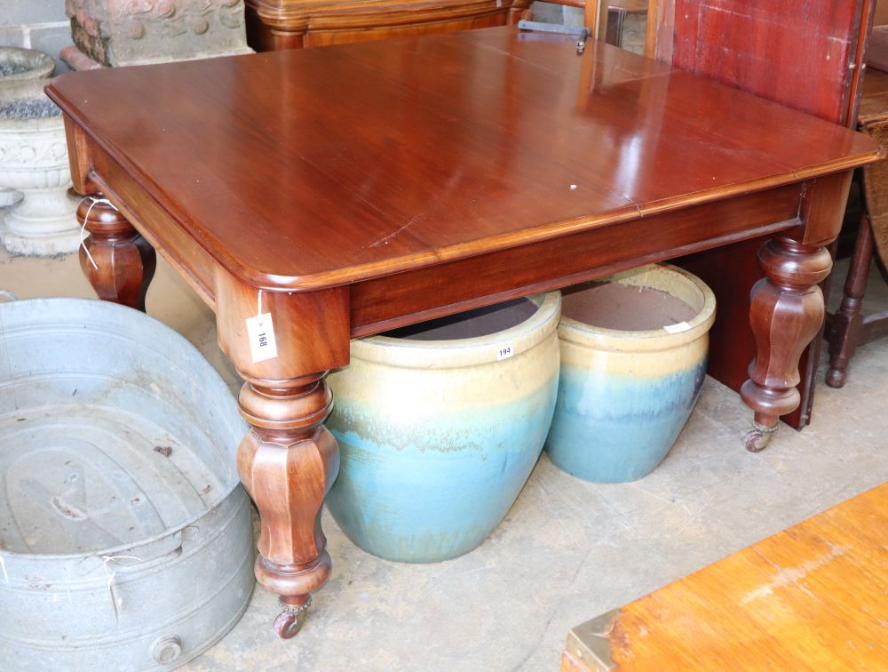 A Victorian mahogany extending dining table, (two spare leaves, 49cm and 56cm) octagonal baluster legs, W.129cm, D.115cm